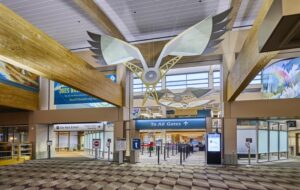 Airport security entrance under decorative wing sculpture