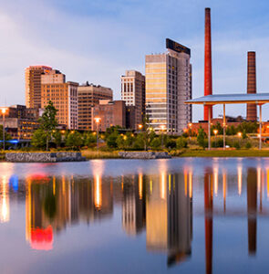Evening waterfront with glowing building reflections