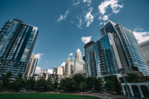 Glass skyscrapers against bright blue sky