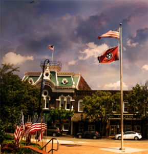 Small town square with waving flags