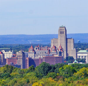 Hilltop view of historic civic buildings and trees