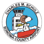 Circular STS emblem showing Snoopy by tower