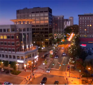 Aerial downtown street glowing with evening lights