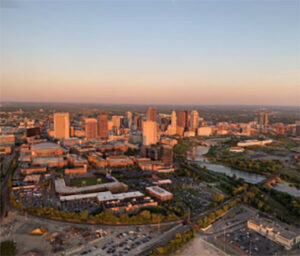 Aerial city skyline glowing at sunset