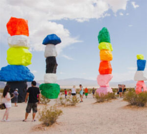 Colorful stacked rock sculptures in desert