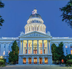 Illuminated state capitol building at dusk