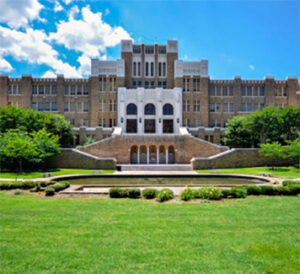 Historic university building with formal lawn