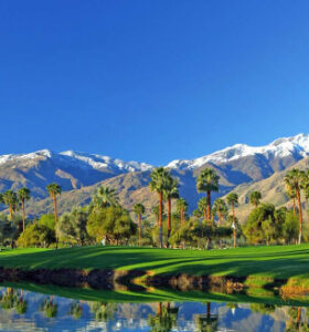 Mountain golf course with palm reflections