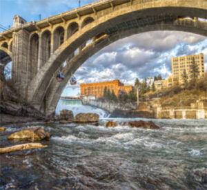 Stone arch bridge over rushing river