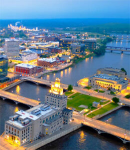 Aerial view of riverfront city at dusk