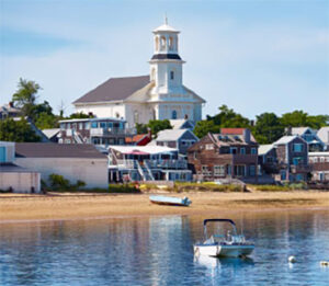 Coastal town harbor with church steeple