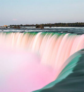 Pastel colored waterfall cascading over a cliff