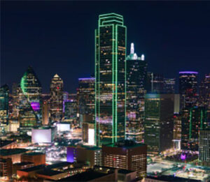 Night skyline with skyscraper outlined in green lights