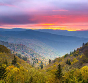 Colorful sunrise over rolling mountain valley