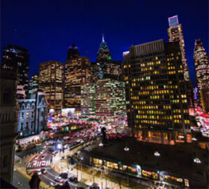 Busy downtown at night with illuminated streets