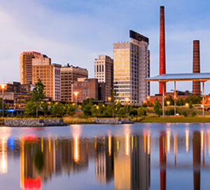 City skyline reflected across calm river